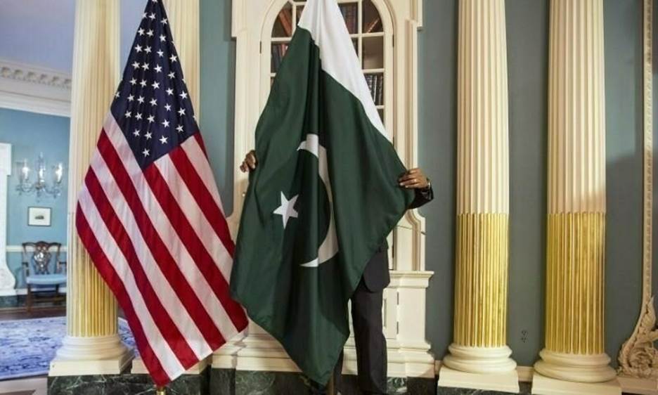 In this February 9, 2015 photo, a State Department contractor adjusts a Pakistan national flag before a meeting between then US secretary of state John Kerry and Pakistan's erstwhile interior minister Chaudhry Nisar Ali Khan on the sidelines of the White House Summit on Countering Violent Extremism at the State Department in Washington. — Reuters/File