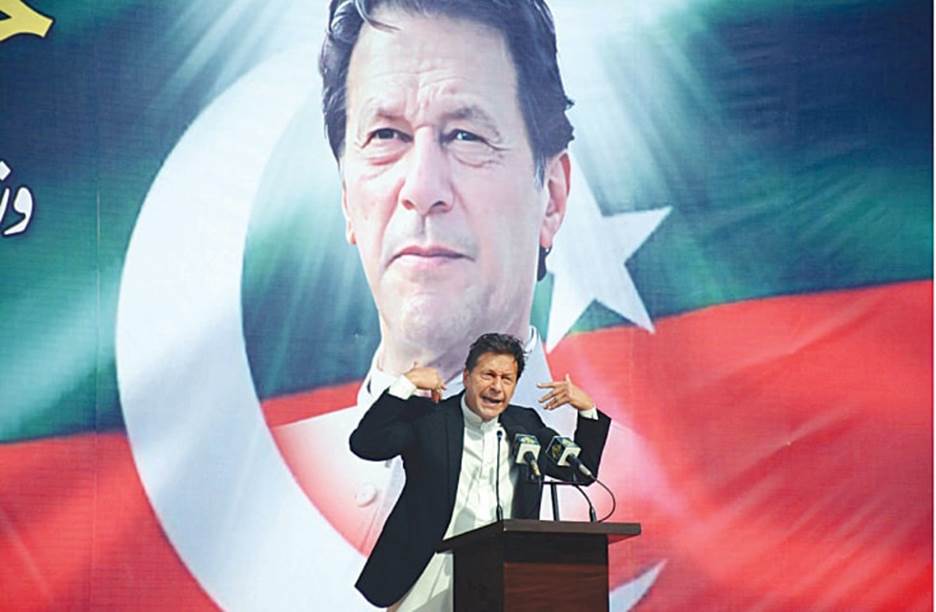 KARACHI: Prime Minister Imran Khan gestures as he addresses party workers at the Governor House on Wednesday.—PPI