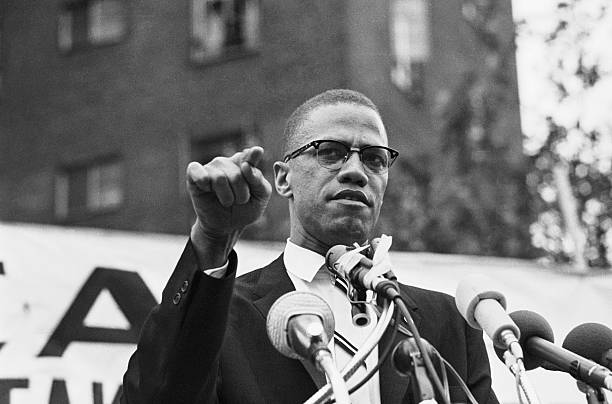 Nation of Islam leader Malcolm X draws various reactions from the audience as he restates his theme of complete separation of whites and African...