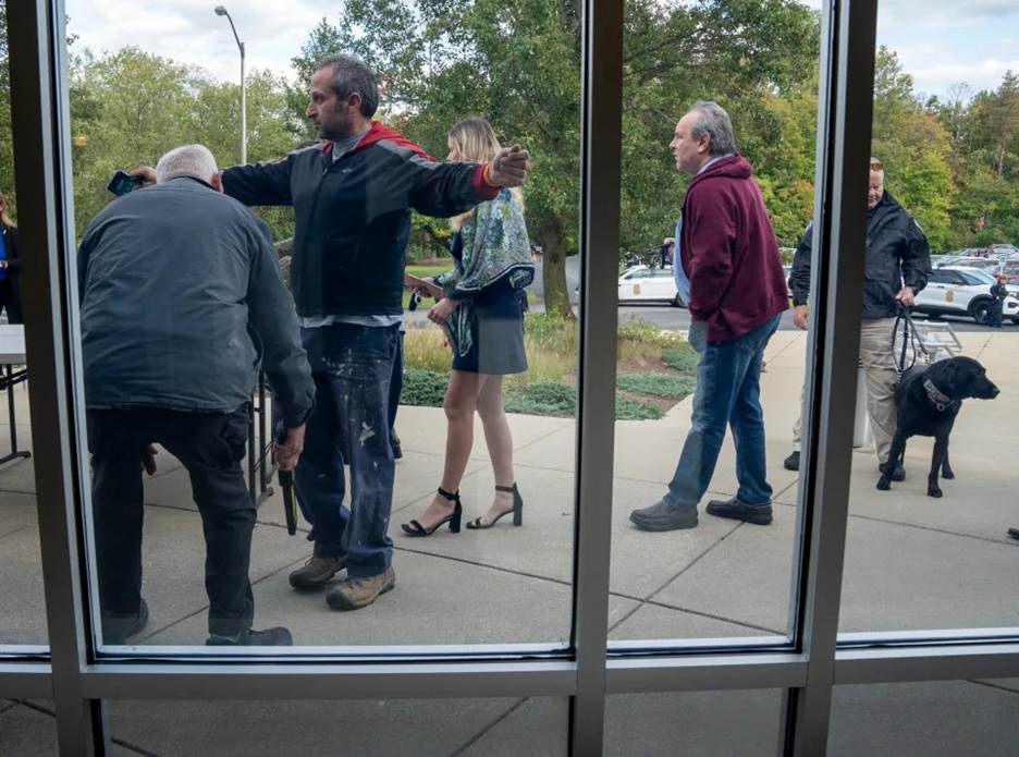 Participants in a solidarity gathering Monday at Indianapolis' Congregation Beth-El Zedeck were screened by a metal detectors and explosives-detecting dogs.