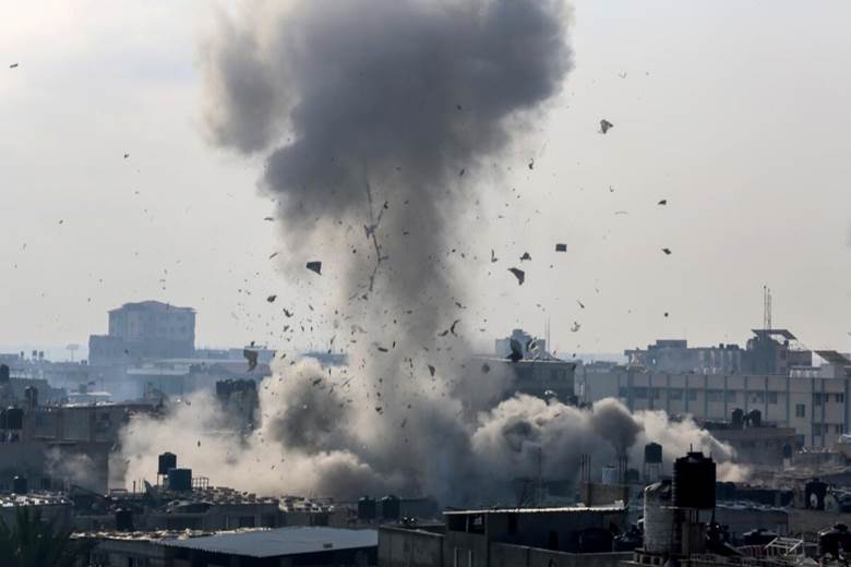 Smoke rises from buildings due to Israeli airstrikes after the humanitarian pause ended on Dec. 1, 2023, in Rafah, Gaza.