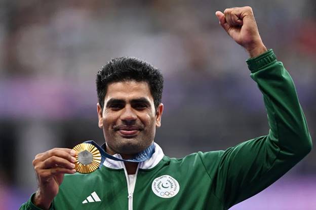 Arshad Nadeem celebrates on the podium during the victory ceremony (Kirill Kudryavtsev / AFP - Getty Images)