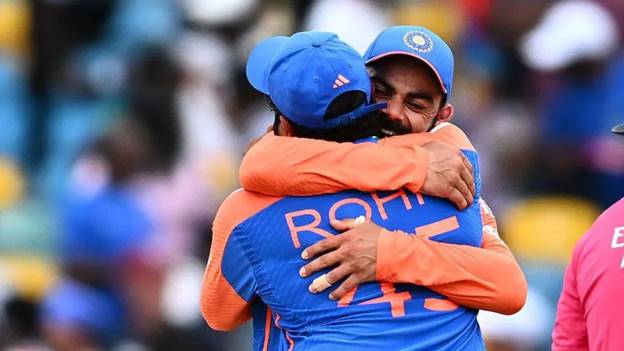 India's captain Rohit Sharma and Virat Kohli celebrate after winning ICC men's Twenty20 World Cup 2024 final cricket match between India and South Africa at Kensington Oval in Bridgetown, Barbados, on June 29, 2024. (Photo by Chandan Khanna / AFP) (Photo by CHANDAN KHANNA/AFP via Getty Images)