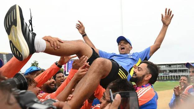 BRIDGETOWN, BARBADOS - JUNE 29: Rahul Dravid, India head coach is thrown into the air after India won the ICC Men's T20 Cricket World Cup West Indies & USA 2024 Final match between South Africa and India at Kensington Oval on June 29, 2024 in Bridgetown, Barbados. (Photo by Philip Brown/Getty Images)