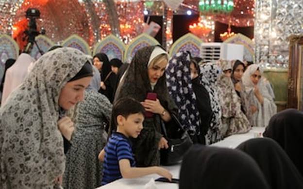 Women in strict Islamic dress code - which Mr Pezeshkian has promised to relax - queue to cast their vote