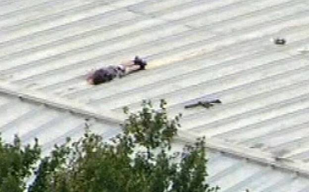 The body of Crooks on the roof from where he shot at Trump, after being killed by a sniper from the Security Service