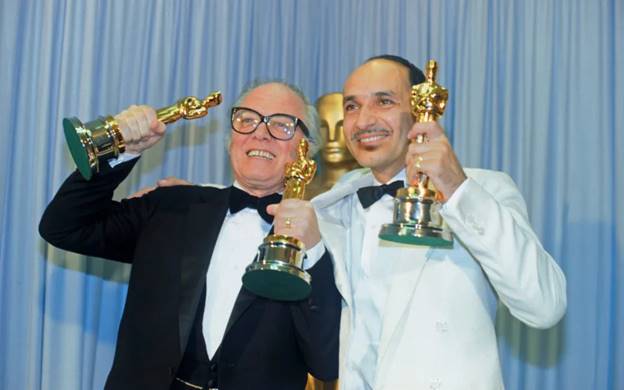 Sir Richard Attenborough and Sir Ben Kingsley with some of the 13 Oscars Gandhi won in 1983