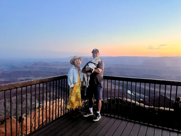 A person and person with a dog on a deck  AI-generated content may be incorrect.