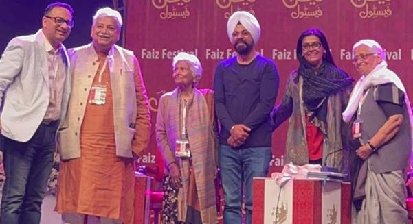 A group of people standing on a stage  AI-generated content may be incorrect.