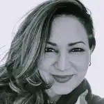 A person smiling at the camera  AI-generated content may be incorrect.