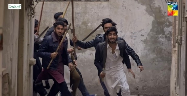 A group of men running with sticks  AI-generated content may be incorrect.