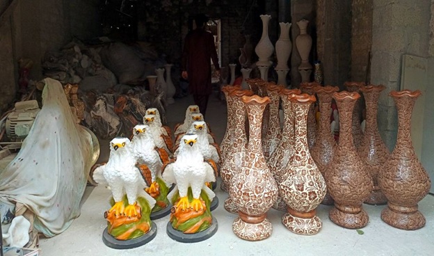 A group of ceramic vases  AI-generated content may be incorrect.