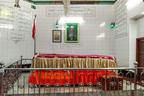 A room with a red table cloth and a metal railing  AI-generated content may be incorrect.