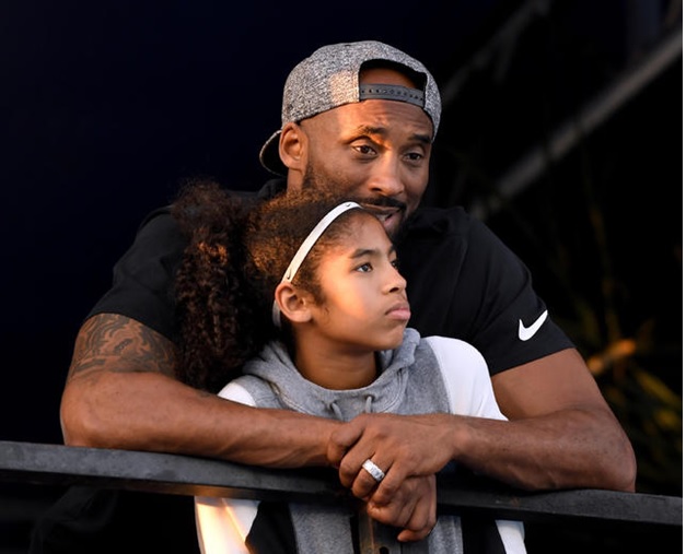 A person and a child leaning on a railing  AI-generated content may be incorrect.