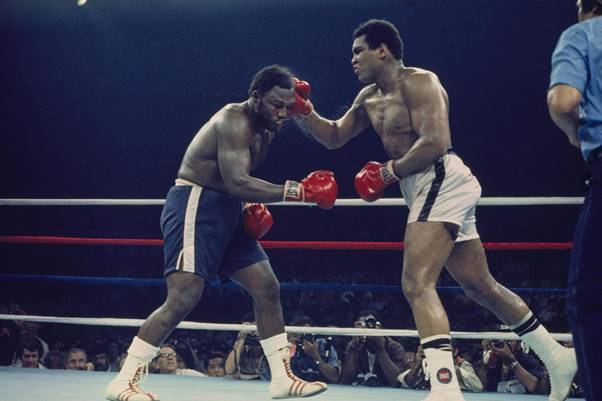 Heavyweight boxer Muhammad Ali punches Joe Frazier during their iconic fight in Manila