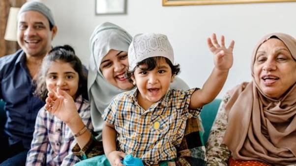 A group of people sitting on a couch  AI-generated content may be incorrect.