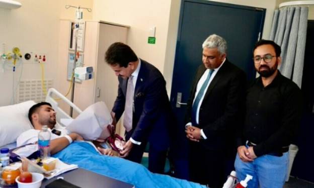 Pakistan’s High Commissioner to Australia Zahid Hafeez Chaudhri visits Pakistani security guard Muhammad Taha at a hospital in Sydney, Australia, April 18. — Zahid Hafeez Chaudhri X