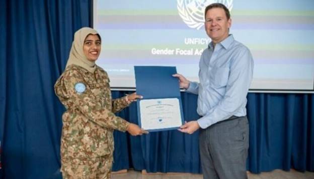 Major Sania Safdar posing with her Certificate of Recognition award with Special Representative of the UN Secretary-General in Cyprus, Colin Stewart. — APP