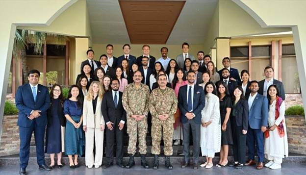 Chief of Army Staff (COAS) General Syed Asim Munir meets with a student delegation from Harvard Business School (HBS) at the General Headquarters in Rawapindi on August 22, 2024. — ISPR