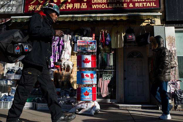  Pedestrians walk in Chinatown