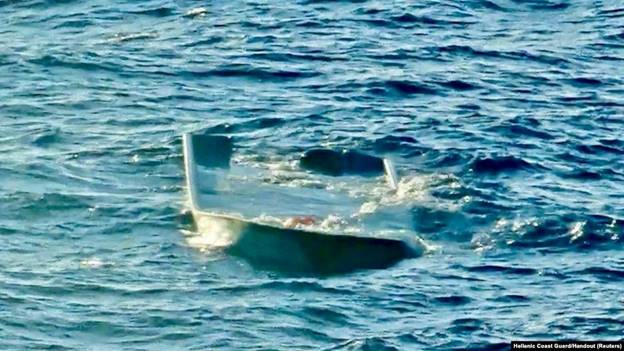 A capsized migrant boat is seen off the island of Gavdos, Greece, Dec. 14, 2024. (Hellenic Coast Guard/Handout via Reuters)