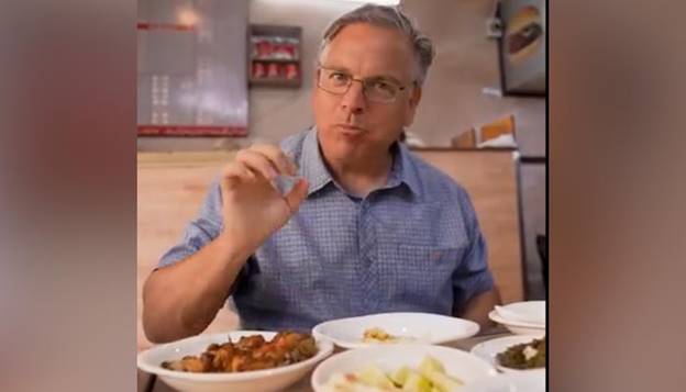 This screengrab of a video released on June 8, 2024 shows US Ambassador to Pakistan, Donald Blome, enjoying food at Karachi’s Burns Road food street. — US Consulate General Karachi