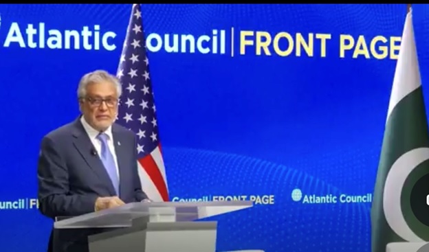 A person standing at a podium with a flag behind him  AI-generated content may be incorrect.