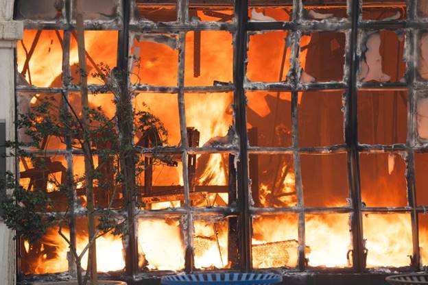 A Chase bank on Sunset Blvd. in the Pacific Palisades neighborhood burns on Jan. 8, 2025 after a wildfire broke out in Los Angeles County on Jan. 7.