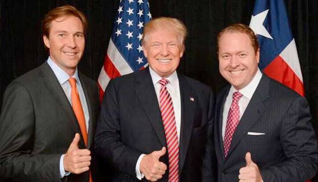 Donald Trump (centre) and Gentry Beach (right) gesture in this file photo. — Reporter