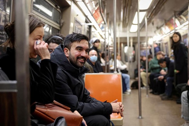 FILE PHOTO: Candidate for New York City mayor Zohran Mamdani rides the subway following a campaigning stop in New York City, U.S., April 1, 2025. REUTERS/Brendan McDermid/File Photo
