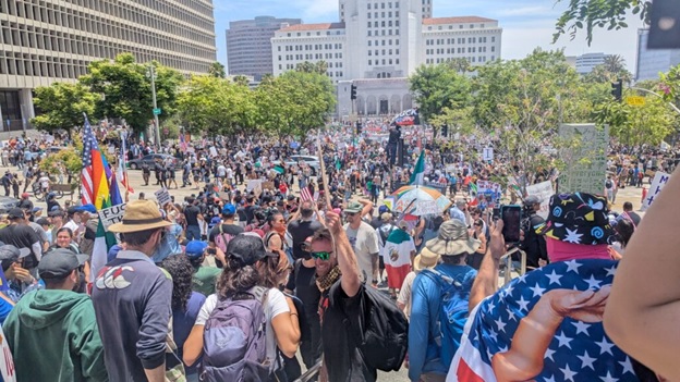 A crowd of people in a street  AI-generated content may be incorrect.