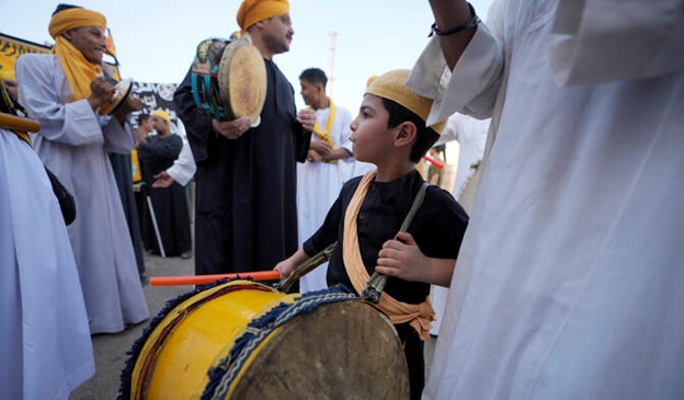 Sufi Muslims perform Zikr, or remembrance of God, as they sing Islamic songs during a parade to commemorate the beginning of the Islamic new year, 1446 Hijri, in Cairo, Egypt, July 7, 2024. (AP)
