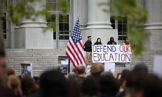 Demonstrators hold a banner during a ‘Stand Up for Internationals’ rally on the campus of Berkeley University in Berkeley, California, US on April 17. — Reuters