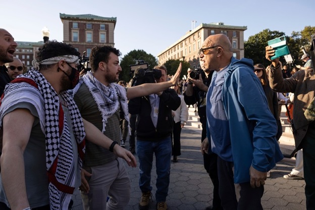 Pro-Palestinian and pro-Israel demonstrators debate at a Columbia University protest.