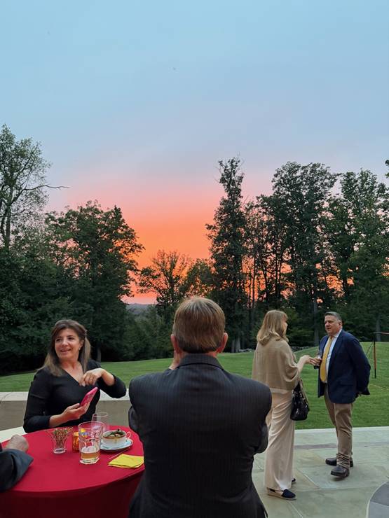 A group of people outside  AI-generated content may be incorrect.