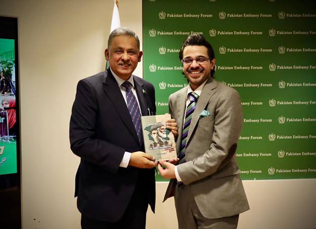 A person in suit sitting next to another person in suit  AI-generated content may be incorrect.