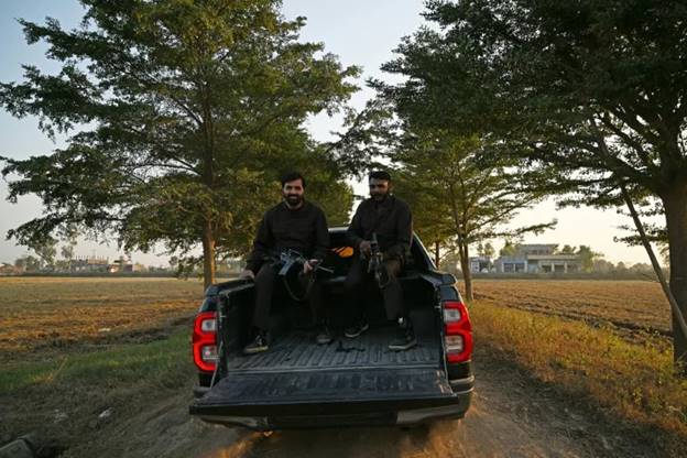 The Toyota Hilux 'has everything', one Pakistani politician told AFP, including room for added security in the cargo bed (Aamir QURESHI)