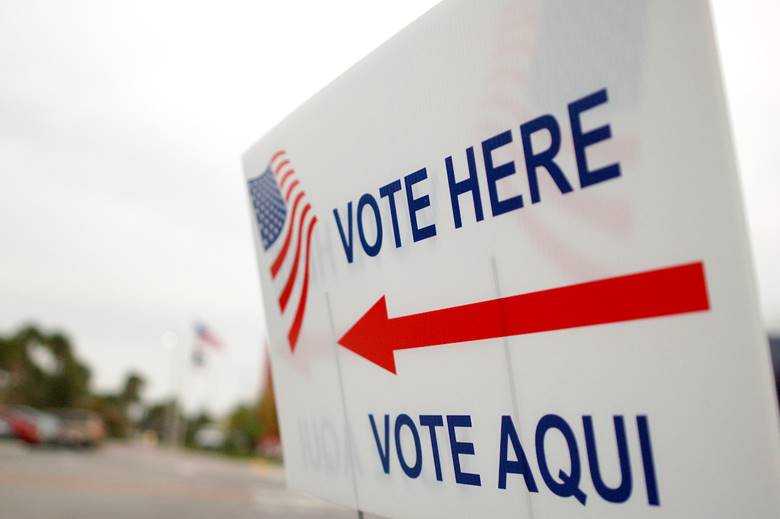 Close-up of a vote sign  Description automatically generated