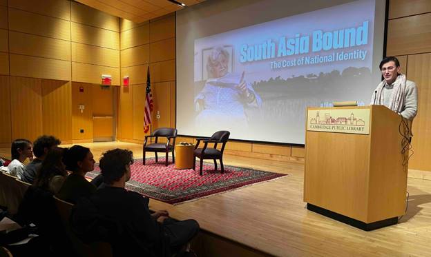 A group of people sitting in front of a podium  AI-generated content may be incorrect.