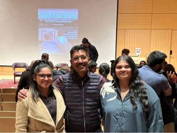 A group of people standing in a room  AI-generated content may be incorrect.