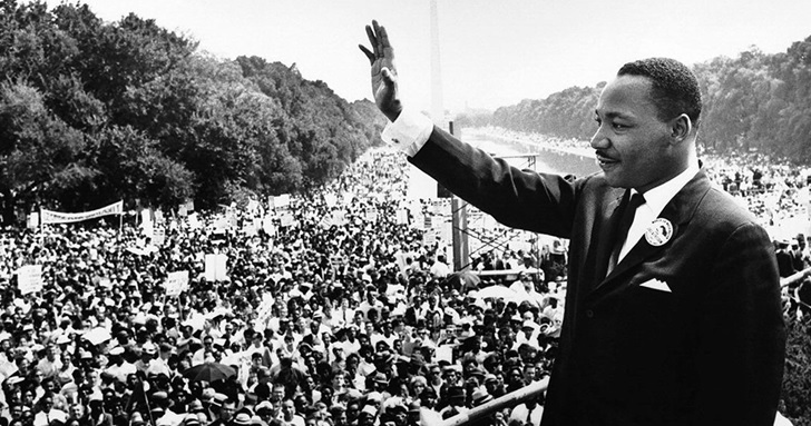 Martin Luther King Jr. waves during the March on Washington in 1963.