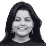 A person with long hair smiling  AI-generated content may be incorrect.