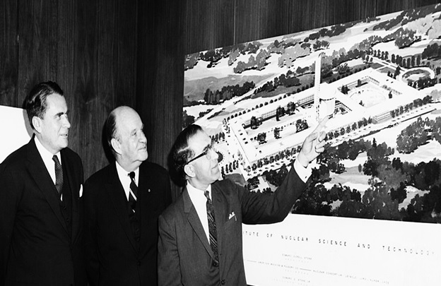 A group of men in suits pointing at a map  AI-generated content may be incorrect.