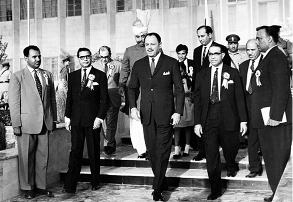 A group of men walking down stairs  AI-generated content may be incorrect.