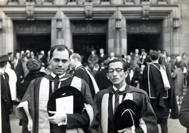 A group of men wearing graduation gowns  AI-generated content may be incorrect.