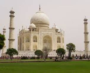 A large white building with a dome and towers with Taj Mahal in the background  AI-generated content may be incorrect.